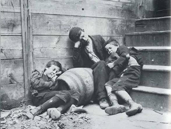 Street children sleeping rough, from How the Other Half Lives